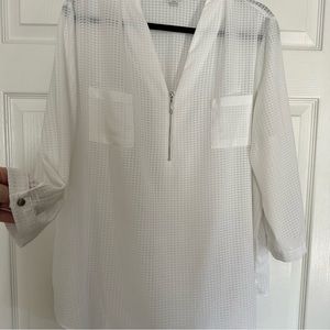 Beautifully styled white, semi-sheer tunic top with silver zipper on bodice.